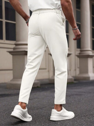 ملابس رجالي Manfinity Mode بناطيل عمل كاجوال واسعة القدمين باللون الواحد مع جيب