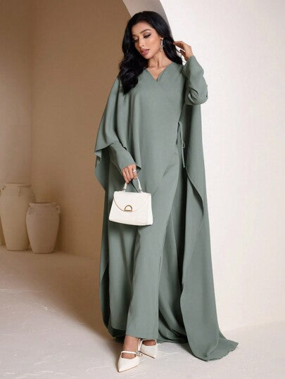 Veilorie جمبسوت أنيقة للنساء سادة اللون بياقة على شكل V وأكمام على شكل خفاش
