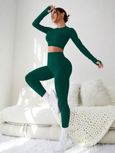 SHEIN Sport Studio طقم رياضي للنساء متكامل من بنطلون وبلوزة بأكمام طويلة، قطعتان من قماش مطاطي ذو لون واحد خالي من التفاصيل