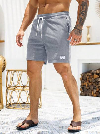 Manfinity Homme شورت رجالي فضفاض مكون من خيط ورقعة بشعارات، شورت رجالي صيفي عادي، ملابس رجالية