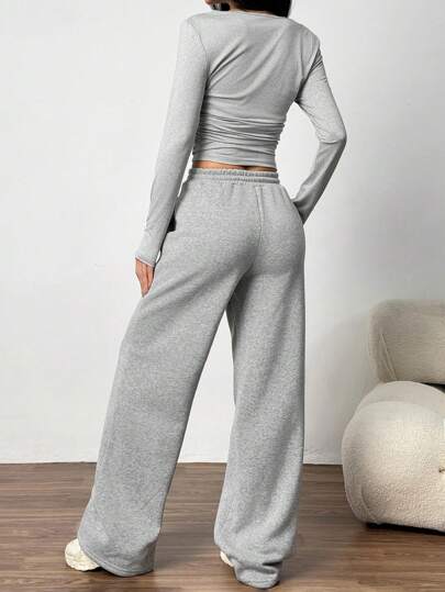 SHEIN EZwear 2 قطعة ألبسة للنساء تتكون من بلوزة بياقة مستديرة وأكمام طويلة وبنطلون مجموعة لون عادي