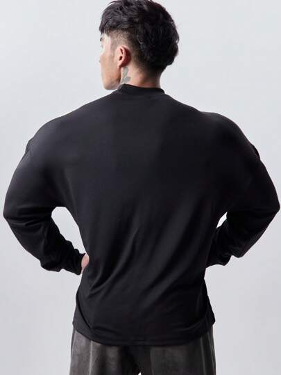 Manfinity Sport Corelite تي شيرت رجالي كاجوال طويل الأكمام قصة فضفاضة بلون سادة