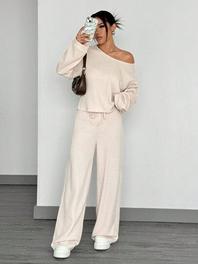SHEIN EZwear مجموعة من قطعتين للنساء تشمل ملابس علوية بأكمام طويلة وسراويل ضيقة ذات لون سادة للملابس الرياضية اليومية
