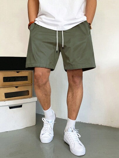 Manfinity Homme شورت كاجوال رجالي فضفاض مع جيوب مائلة وخصر بسحاب