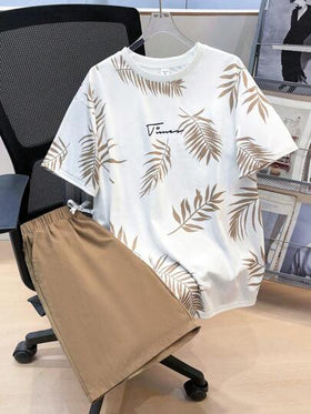 SHEIN مجموعة 2 قطعة تيشرت برسومات أوراق استوائية وشورت بخصر رباط ،ملابس الربيع للمراهقين، ملابس أولاد المراهقين ، سترات أولاد المراهقين، عودة المدرسة للربيع