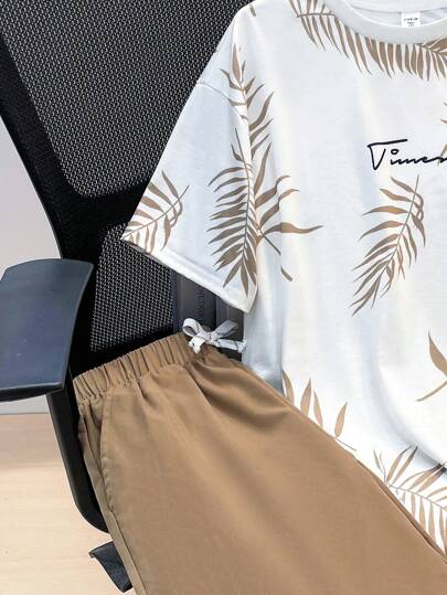 SHEIN مجموعة 2 قطعة تيشرت برسومات أوراق استوائية وشورت بخصر رباط ،ملابس الربيع للمراهقين، ملابس أولاد المراهقين ، سترات أولاد المراهقين، عودة المدرسة للربيع