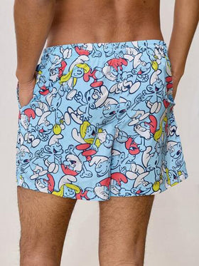SHEIN X The Smurfs شورت كاجوال للرجال فضفاض منسوج مطبوع بالكرتون على السطح الأزرق، للشاطئ الهاواي