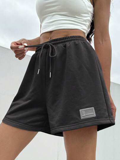 SHEIN EZwear شورت رياضي صيفي فضفاض وكاجوال باللون الوردي ، بخصر سحاب وتفاصيل رقع