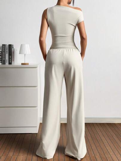 EZwear مجموعة بنطال وبلوزة غير متماثلة بلون أحادي للنساء لارتداء اليومي