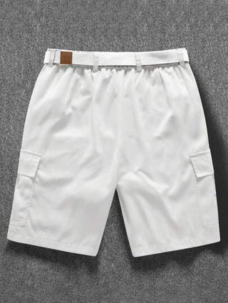 Manfinity Homme شورت رجالي كاجوال لحمل البضائع ذو لون أحادي مع جيوب أمامية وأزرار