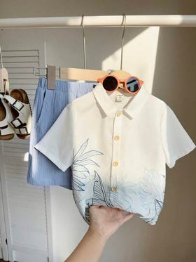 SHEIN مجموعة قميص وشورت 2 قطعة للأولاد الصغار، زي كاجوال قابل للاستخدام اليومي بطبعات نباتات أنيقة ، أكمام قصيرة، ياقة هاواي، مناسب للربيع / الصيف ، لليومي والرياضة والخروج والمدرسة والحفلات والأعياد والتصوير، العودة إلى المدرسة والإجازات والشاطئ