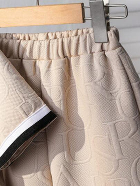 SHEIN مجموعة من قطعتين للأولاد الصغار، ملابس علوية بياقة بولو مع تريم كونتراست وسحاب وشورت مافي قطعة محبوكة