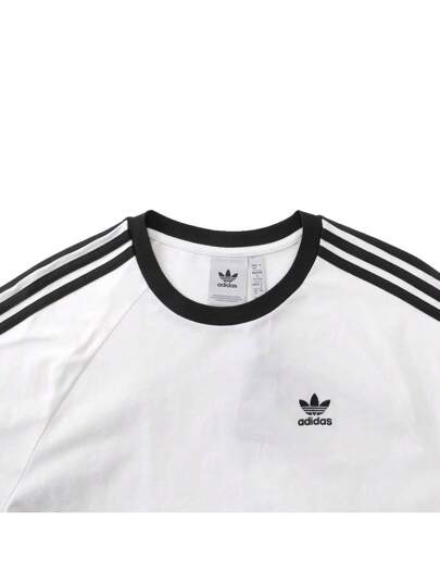 Adidas Originals 2025 صديقك لحمت كم طويل، تي شيرت كلاسيكي طويل الأكمام للرجال، ملبوس بنسيج محبوك بدون ياقة TKE5825