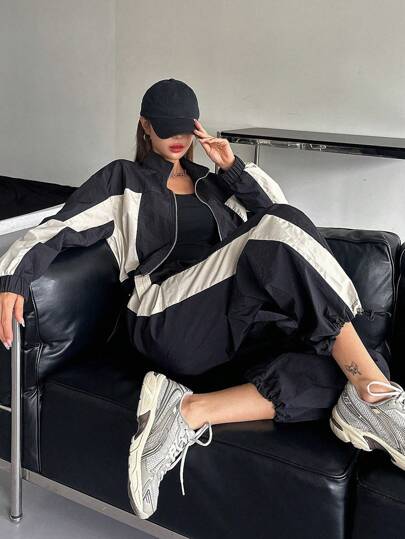 DAZY بدلة سحاب أمامي مع رباط طويلة الأكمام بتصميم لوني متباين للنساء، قطعتان