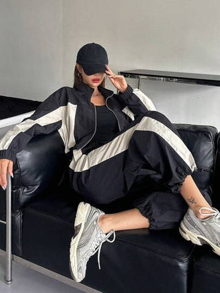 DAZY بدلة سحاب أمامي مع رباط طويلة الأكمام بتصميم لوني متباين للنساء، قطعتان