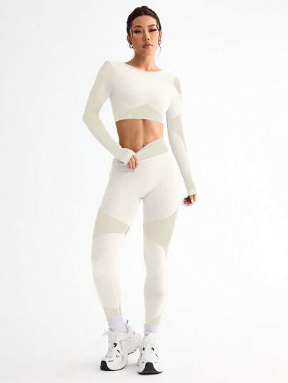SHEIN Sport Studio طقم ملابس رياضة نسائية بسترة بأربطة متقاطعة من الأكمام الطويلة وبنطال