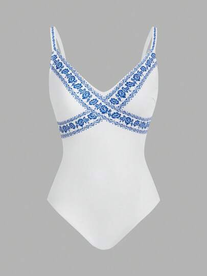 SHEIN Swim Oasis مجموعة قطعتين بنقشة زهرية، بدلة سباحة قطعة واحدة بياقة على شكل حرف V وبنطال ساق واسع للارتداء فوقها في عطلة الشاطئ