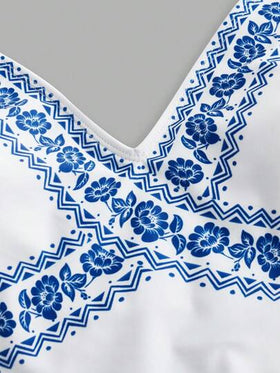 SHEIN Swim Oasis مجموعة قطعتين بنقشة زهرية، بدلة سباحة قطعة واحدة بياقة على شكل حرف V وبنطال ساق واسع للارتداء فوقها في عطلة الشاطئ
