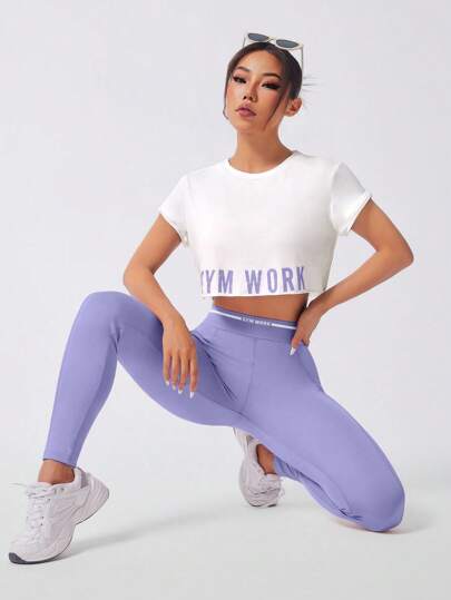 SHEIN Sport Studio مجموعة رياضية للنساء 3 قطع طقم رياضي مكون من: ملابس علوية كامي ظهر متقاطع مطبوع عليه رسوم، ملابس علوية كم قصير، وباطار خصر عالي للربط للياقة البدنية