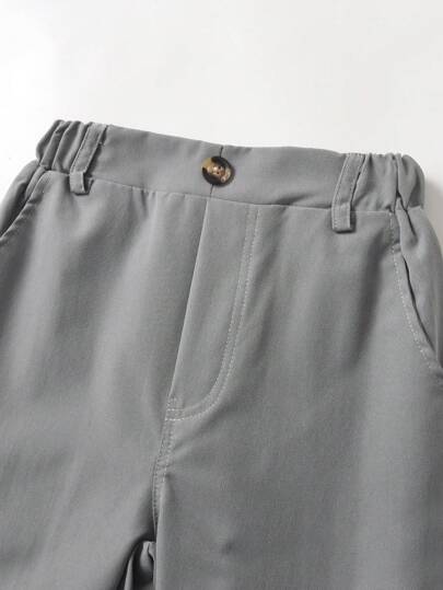 SHEIN بنطلون صبي كاجوال أحادي اللون ، زخرفة بزر واحد ، جيب مائل ، تصميم خصر مرن ، مريح للارتداء اليومي ، للسفر ، الحفلات ، المهرجانات ، متعدد الاستخدامات وأنيق