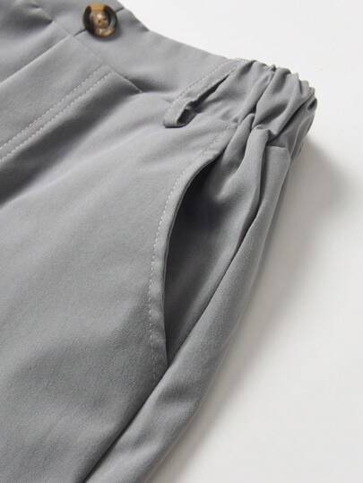 SHEIN بنطلون صبي كاجوال أحادي اللون ، زخرفة بزر واحد ، جيب مائل ، تصميم خصر مرن ، مريح للارتداء اليومي ، للسفر ، الحفلات ، المهرجانات ، متعدد الاستخدامات وأنيق