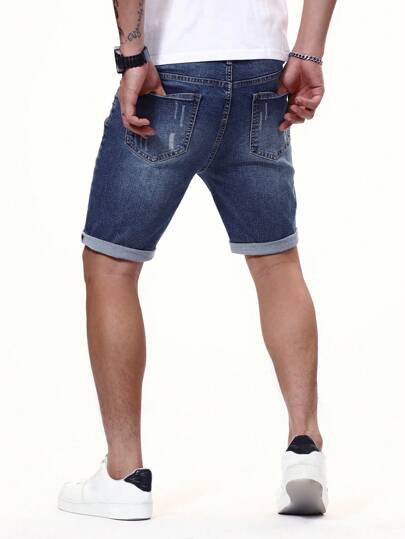 Manfinity Homme شورت جينز رجالي ممزق برسمة حافة مطوية من الأسفل باللون الأزرق الداكن، مناسب للعطلات وللأصدقاء العزيزين