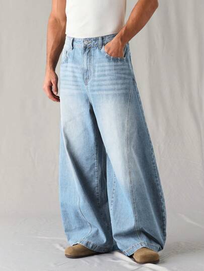 Manfinity Denimwave جينز رجالي فضفاض بقصة برميل أزرق متوسط مغسول، جينز رجالي فضفاض، جينز يونيسكس مغسول بنمط القمر مشوه