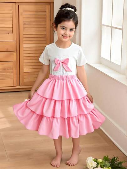 girls-sets طقم للبنات بتصميم عذب ألماسي الفيونكة تي شيرت + تنورة توتو، قماش تي شيرت ناعم ومريح، مزين بديكور فيونكة لامعة، مقترن مع تنورة فيونكة وردية مرصعة بفراشات مع كشكشة في الخصر وهامش، فستان صيفي قصير