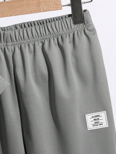 SHEIN مجموعة قطعتين من بدلة ملابس للأولاد المراهقين بطراز كاجوال كوليجي، تي شيرت بطبعة حرفية على الرقبة المستديرة وبنطلون طويل، مناسبة للتنقل والمدرسة والاستخدام اليومي والرياضة في الربيع والصيف