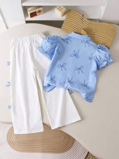 SHEIN Genkimix Kids قطعتان / مجموعة قميص أكمام قصيرة منتفخة مطبوع عليه فيونكة وبنطلون للفتيات الصغار