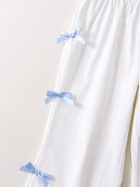 SHEIN Genkimix Kids قطعتان / مجموعة قميص أكمام قصيرة منتفخة مطبوع عليه فيونكة وبنطلون للفتيات الصغار