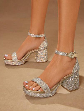 SHUZIA كعب عالٍ مرصع بالكريستال بلون الذهب الوردي لسيدات #RedCarpetReady - أربطة من الراين متعددة الأشكال وأقفال كاحل قابلة للتعديل | كعب مستقر مكعب للحفلات الراقية من حفلات الزفاف إلى السهرات السوداء