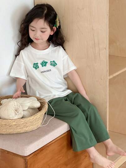 Dazy Kids ملابس فتاة صغيرة للخريف: بلوزة تي شيرت بياقة مستديرة وأكمام قصيرة مطبوعة + بنطلون صوفي أحادي اللون، طقم منزلي للربيع/الصيف رمضان