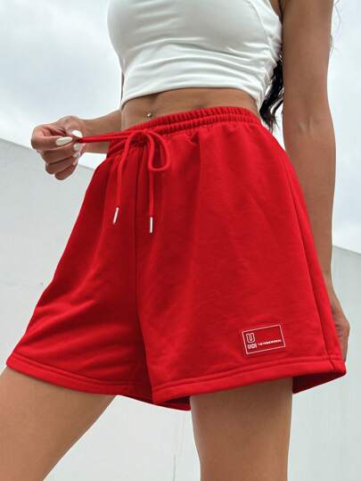 SHEIN EZwear شورت رياضي صيفي فضفاض وكاجوال وردي اللون، خصر قابل للربط، وبتفاصيل رقعة