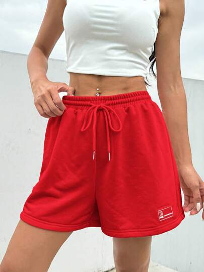 SHEIN EZwear شورت رياضي صيفي فضفاض وكاجوال وردي اللون، خصر قابل للربط، وبتفاصيل رقعة