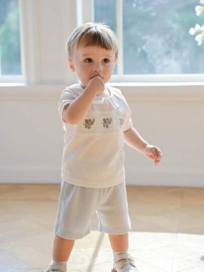 SHEIN طقم صيفي لصبيان الأطفال الرضع: بلوزة بياقة بولو و سروال طويل مصنوعان من قماش المربعات المطرز بالفيل، أكمام قصيرة وسحابات أمامية