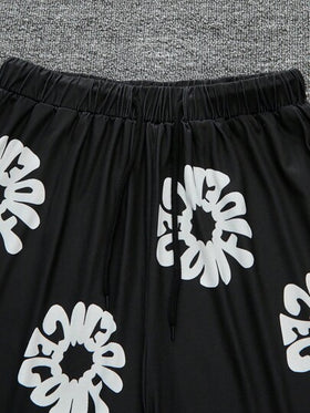 SHEIN شورت أسود فضفاض مطبوع للمراهقين (الأولاد)
