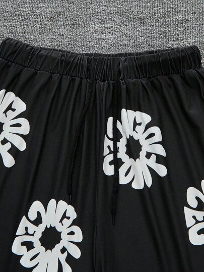 SHEIN شورت أسود فضفاض مطبوع للمراهقين (الأولاد)