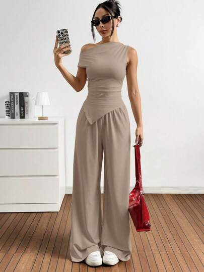 EZwear مجموعة من قطعتين - ملابس علوية ذات ياقة غير متماثلة بلون أحادي وبنطلون مزود بجيوب ، مجموعة محبوكة للنساء