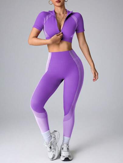 Seamluxe SHEIN Sport مجموعة رياضية تتكون من توب بأكمام قصيرة بتصميم اللونين المتناقضين وسروال ليغنغ