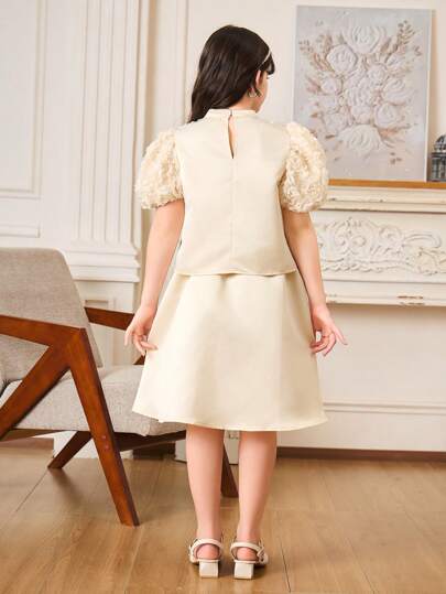 girls-sets طقم بناتي للمراهقات - توب مضلع ذو أكمام منفوشة قصيرة وتنورة ساتان الخوخي متوسطة الطول (مجموعتان)