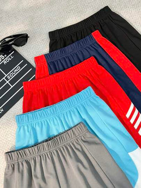 SHEIN Explorewe شورتات أولادي فضفاضة بلون أحادي عصرية، مناسبة للصيف