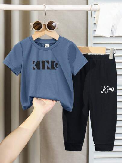 SHEIN مجموعة ملابس علوية أكمام قصيرة محبوك بنمط حرفي وبنطلون بخصر مطاطي مناسبة للرضيع ولد/بنت لارتداء اليومي والمدرسة والسفر والرياضة في الربيع/الصيف