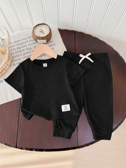 SHEIN طقم قطني ناعم للأطفال الرضع بنطال خصر مطاطي وبلوزة كم قصير قطعتان، ملابس كاجوال مناسبة للخروج في الربيع والصيف، للمدرسة والمنزل