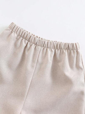 SHEIN 2 قطعة/مجموعة قميص بأكمام قصيرة لون أساسي وشورت بخصر مطاطي للأطفال الذكور والإناث، مناسب للارتداء في الصيف للبقاء في المنزل أو الخروج أو السفر والعطلات