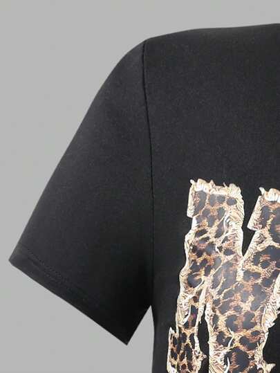 SHEIN Explorewe طقم فضفاض من ملابس علوية وبنطلون للبنات بنقشة نمر والفتيات وشريطة وقطع بصور حروف، مكون من قطعتين