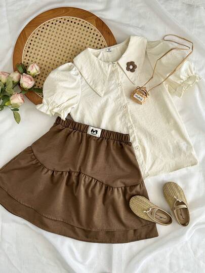 girls-sets Vintaside Kids طقم للبنات من قميص قصير الأكمام مناسب للصيف مع تنورة غربية عصرية وجذابة مثالي للموسم الصيفي. التصميم عملي وأنيق، يوفر الدفء والأناقة للخارج أو وقت الراحة في المنزل