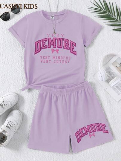 girls-sets 2 قطعة/طقم ملابس للبنات، بنطلون رياضي أسود قصير مع تيشيرت قصير الأكمام مزين بطبعات الأقواس والحروف الإنجليزية بشكل كرتوني، بسيط وراحة للفتيات الناشئات مناسب للارتداء اليومي خلال الربيع والصيف