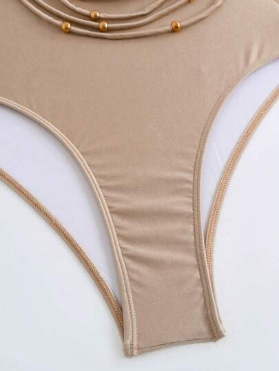 Swim Chiccia بدلة سباحة نسائية قطعة واحدة ذات رقبة مستديرة وحزام عنق، لون أحادي مع زخرفة من الخرز المعدني المجوف والشراريب، مناسبة لموسم الربيع والمهرجانات البوهيمية
