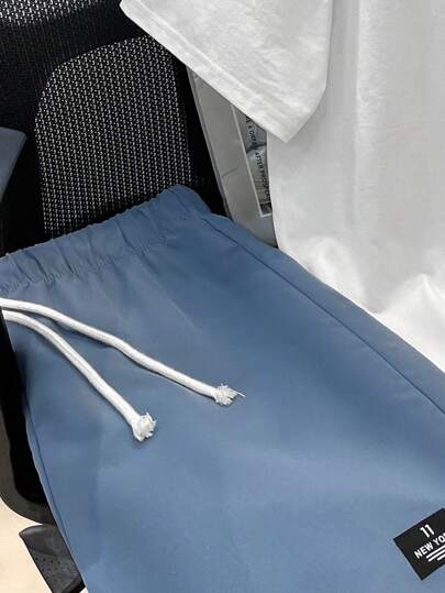 SHEIN مجموعة ملابس علوية كم قصير وشورت كاجوال للصبية 2 قطعة، بطراز وشارع، روك بنك، أسلوب مدرسي، مناسب لفصلي الربيع والصيف، حفلات، مهرجان موسيقى، طباعة الرسوم الإنجليزية والألوان الكتلية